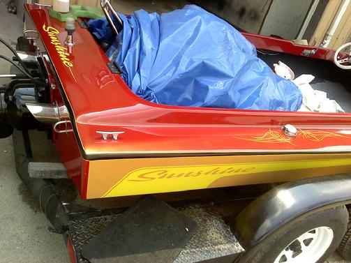 Hand lettered boat name, hand pinstripes& vynal side stripes on this flat bottom jet boat